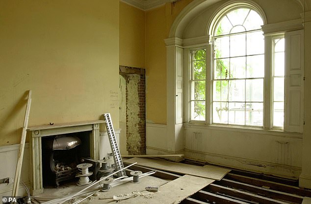 Ripped up floorboards and exposed brickwork can be seen in the front reception room of the Grade-II building once admired by both King George IV and King Edward VIII