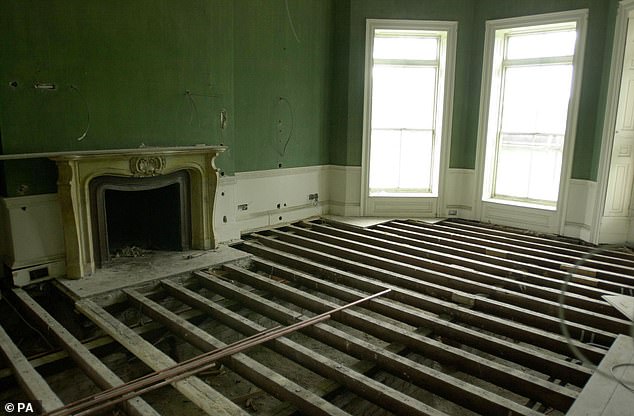 Another reception room showed all of the floorboards taken up as well as another grand fireplace