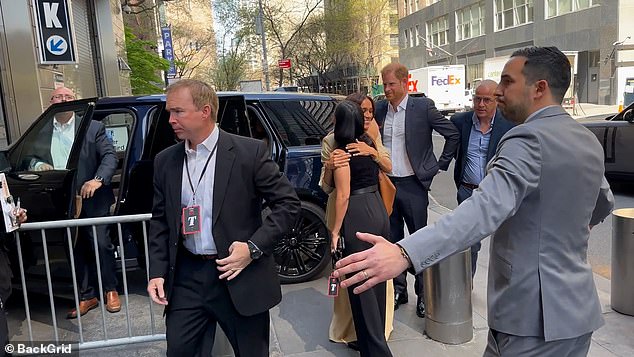 James wrote: 'This is clearly Meghan's moment and instead of introducing him to the woman she has just hugged in greeting, she turns her back on Harry to walk into the venue'