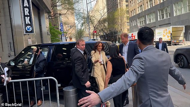 Upon their arrival earlier, Harry chaperoned his wife from their private car as she walked in - before also being around to greet her at the end of her stint on stage