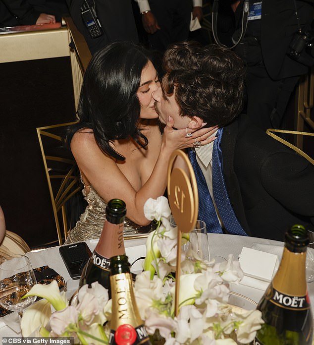 The insider confirmed the couple are 'very much together and don't need to be in person together every day for it to work' (seen in January 2025)