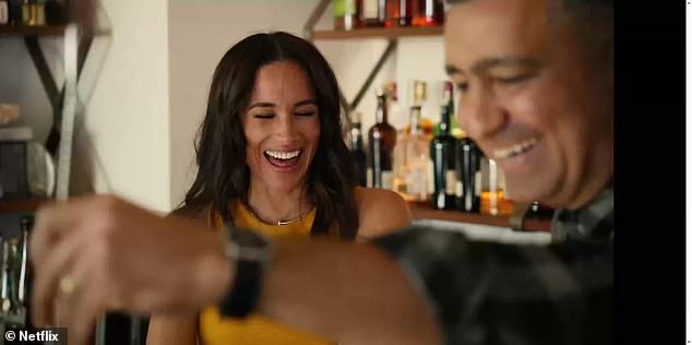 Meghan Markle was forced to laugh off a very awkward interaction during the newly-released second season of her show With Love, Meghan. (Pictured: Meghan with mixologist Payman Bahmani-Bailey)
