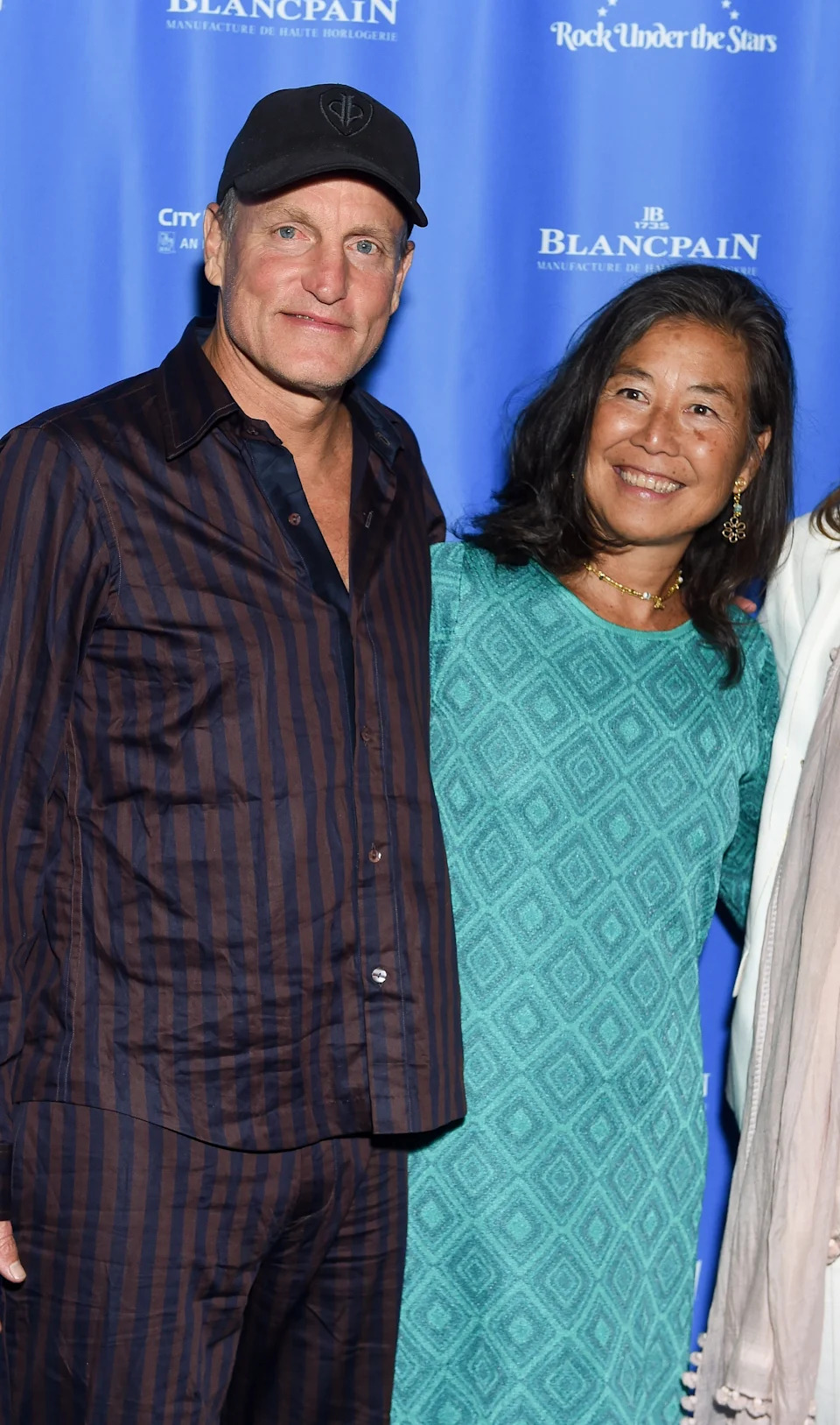 Woody Harrelson and Laura Louie at a public event