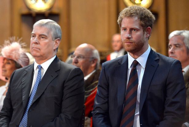 Prince Andrew and Prince Harry sit stony-faced next to each other