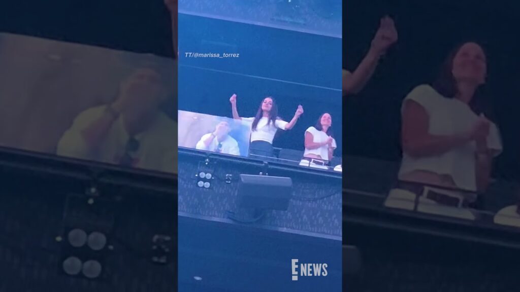 Ashton Kutcher and Mila Kunis at Backstreet Boys Concert