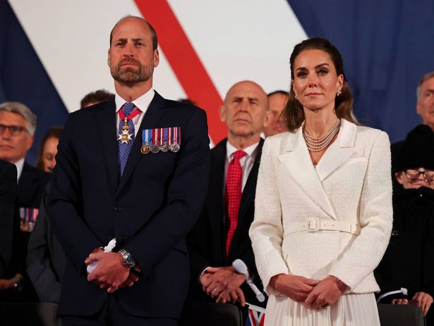William and Kate stand to listen to the King's speech 