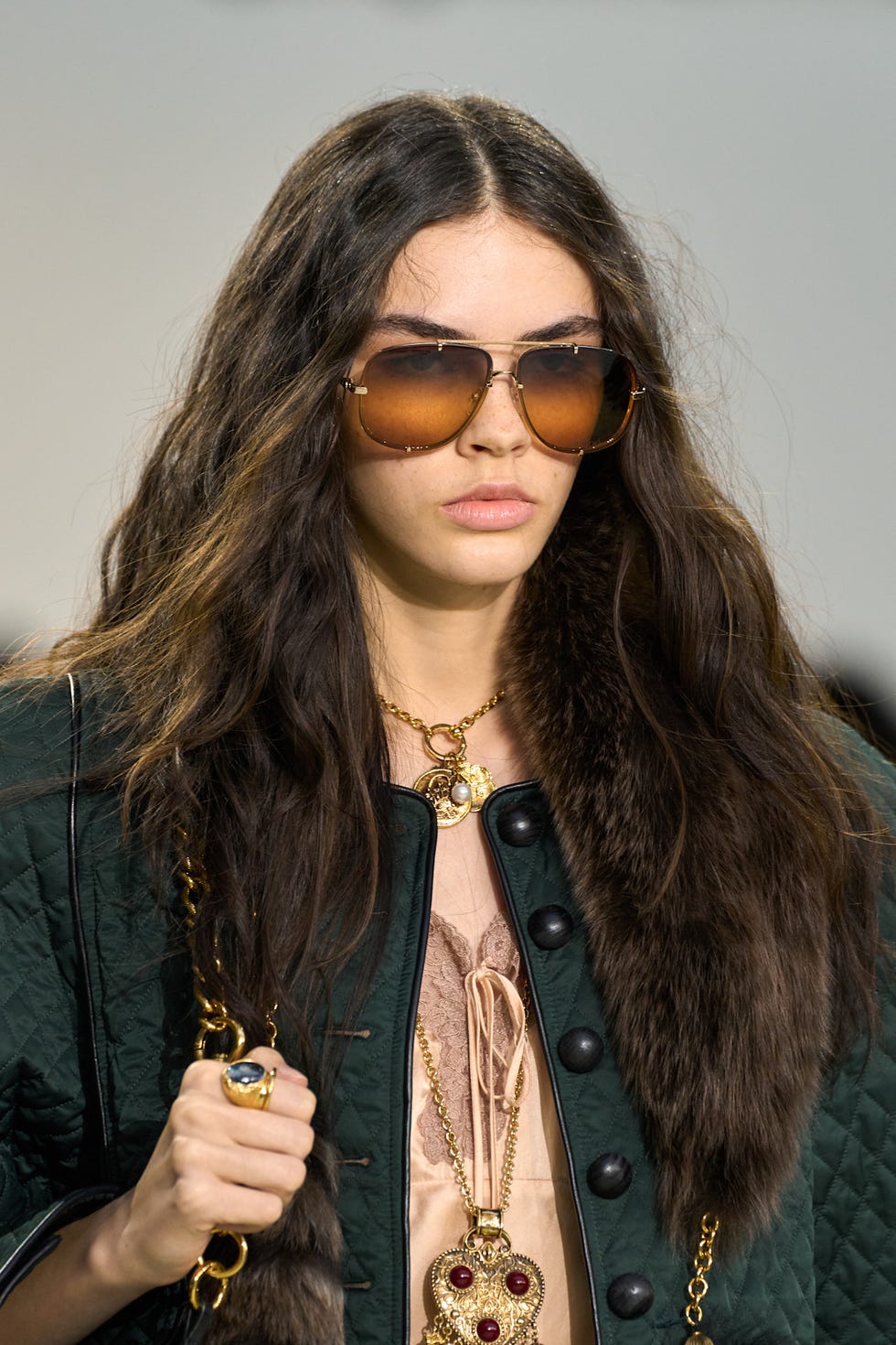 Fashion model showcasing a stylish outfit with accessories