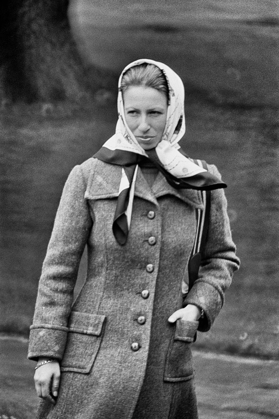 windsor, england circa 1978: princess anne, princess royal pictured at the windsor horse show wearing a buttoned single breasted tweed coat with flap pockets and a silk headscarf. (photo by derek hudson/getty images)