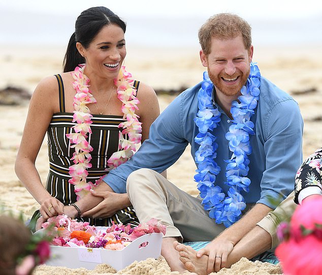 Mandatory Credit: Photo by DAN HIMBRECHTS/EPA-EFE/Shutterstock (9937718o) Britain's Prince Harry, the Duke of Sussex and his wife Meghan, the Duchess of Sussex take part in a 'Fluro Friday' session run by OneWave, a local surfing community group raising awareness for mental health and wellbeing, at Bondi Beach in Sydney, Australia, 19 October 2018. The Duke and Duchess of Sussex are on a 3-week tour of Australia, New Zealand, Tonga, and Fiji and are in Sydney to launch the 2018 Invictus Games, an Olympic-style event for disabled and ill service people. The Duke and Duchess of Sussex tour Australia, Sydney - 19 Oct 2018