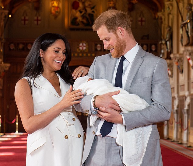 (FILES) Britain's Prince Harry, Duke of Sussex (R), and his wife Meghan, Duchess of Sussex, pose for a photo with their newborn baby son, Archie Harrison Mountbatten-Windsor, in St George's Hall at Windsor Castle in Windsor, west of London on May 8, 2019. Prince Harry would "love for reconciliation" with his estranged family, but "can't see a world" in which he would bring his wife and children to the UK after losing a security court case, he told the BBC on May 2, 2025. "Some members of my family will never forgive me for writing a book... but I would love for reconciliation," Harry told the BBC, adding that "I can't see a world in which I would be bringing my wife and children back to the UK." (Photo by Dominic Lipinski / POOL / AFP) (Photo by DOMINIC LIPINSKI/POOL/AFP via Getty Images)