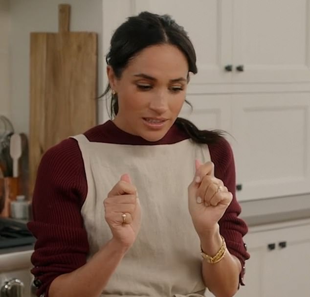 Uncl grabs: 15035221 Meghan making biscuits in jewellery worth £100,000