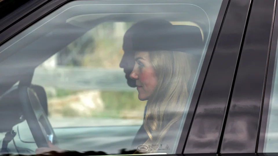 Kate Middleton departs by car with Prince William at Crathie Kirk after attending the church service on Aug. 24 in Crathie, Aberdeenshire. (Photo by Jeff J Mitchell/Getty Images)