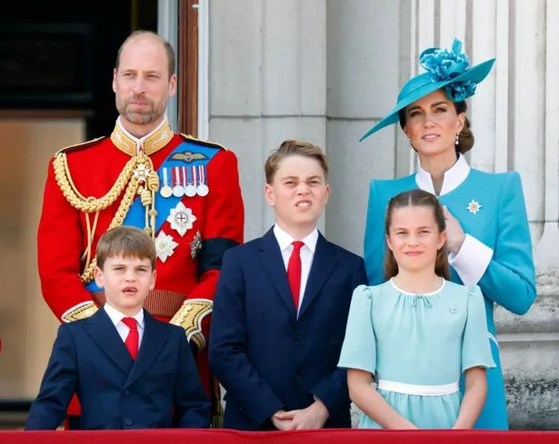 Prince William, Prince of Wales (Colonel of the Welsh Guards), Prince Louis of Wales, Prince George of Wales, Catherine, Princess of Wales and Princess Charlotte of Wales watch an RAF flypast