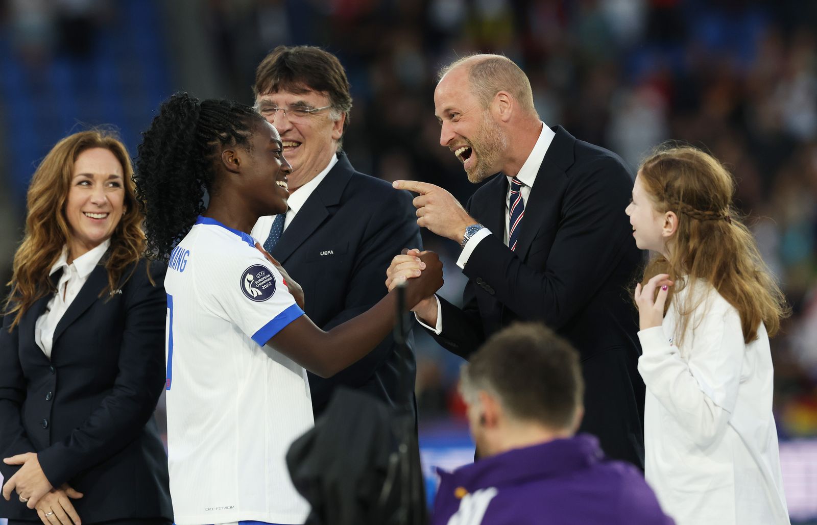 Michelle Agyemang of England shakes hands with Prince William Prince of Wales after the team's victory in the UEFA...