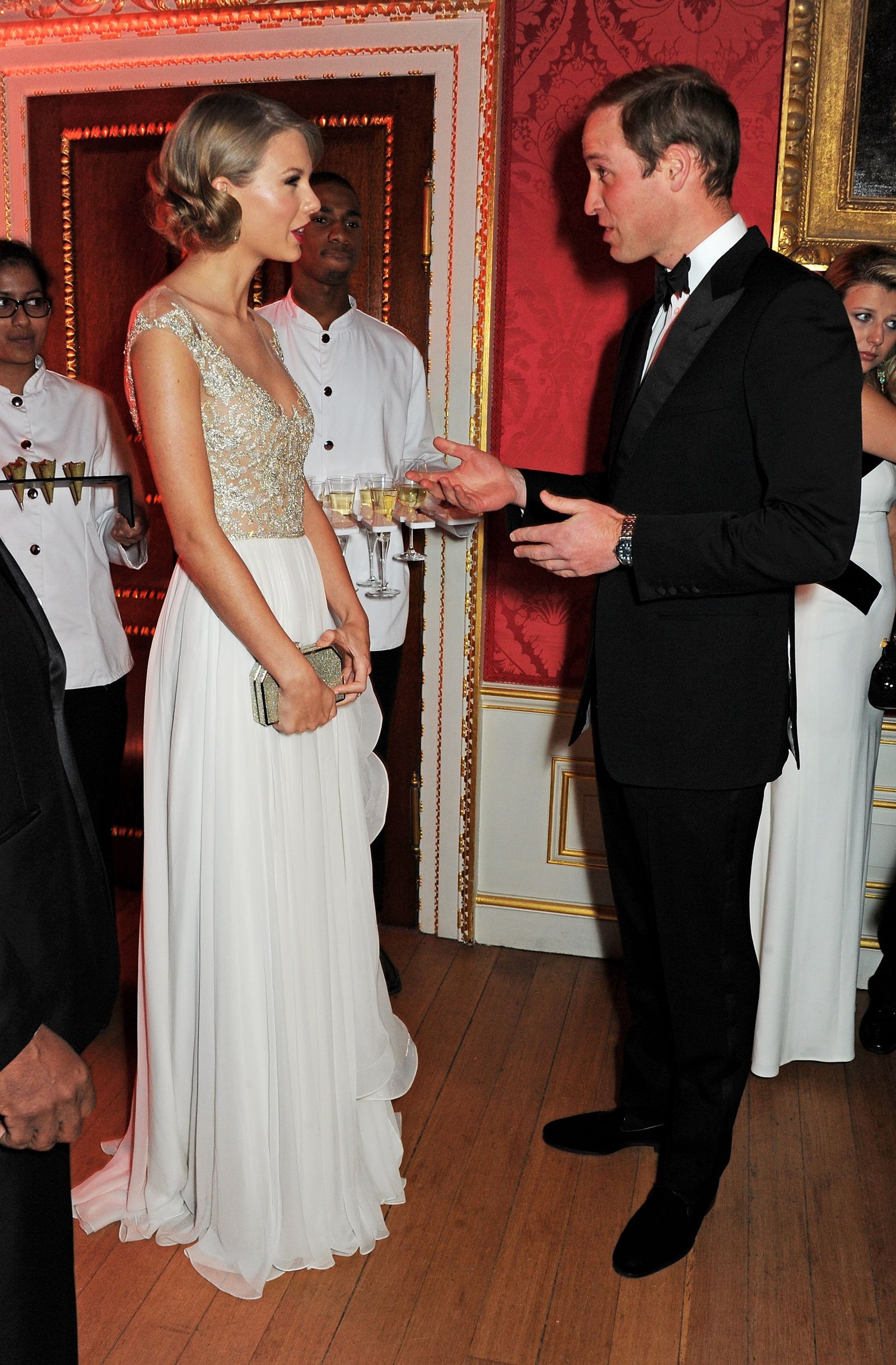 Image may contain Prince William Duke of Cambridge Taylor Swift Person Accessories Formal Wear Tie and Glasses