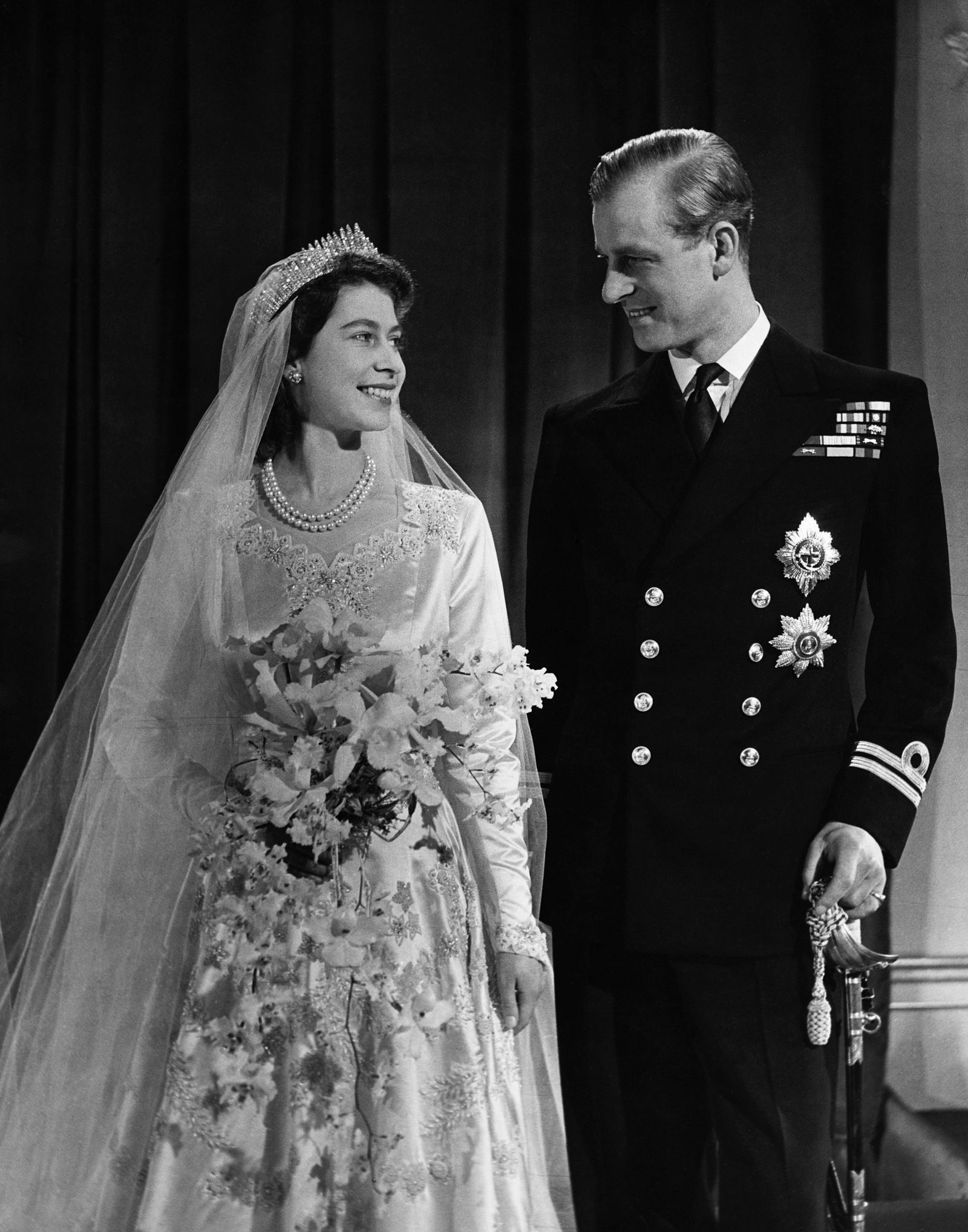 Image may contain Philip Tomalin Elizabeth II Clothing Dress Adult Person Wedding Coat Fashion and Formal Wear