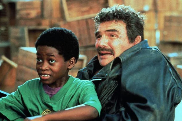 Cinematic / Alamy Norman D. Golden II and Burt Reynolds film a scene for 
