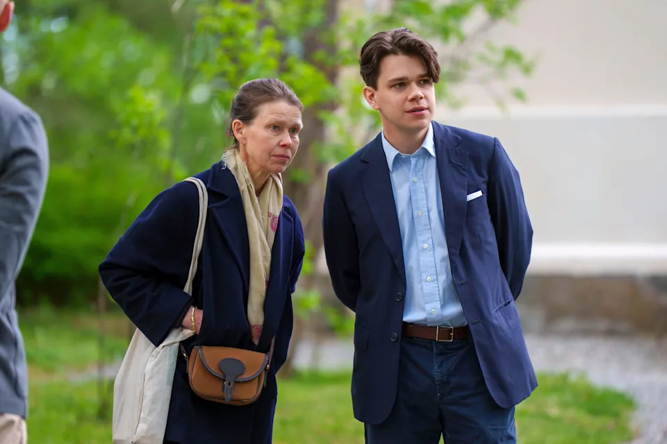 Sarah Chatto and Sam Chatto both wearing blue jackets standing in front of a tree