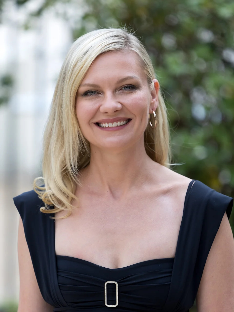 Kirsten Dunst smiling outdoors