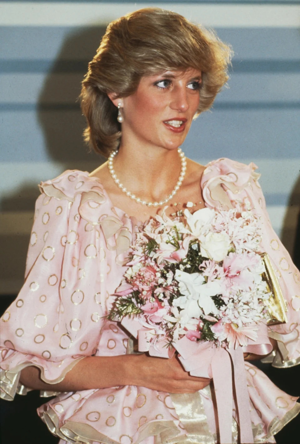 Hulton Archive/Getty Images - Princess Diana wearing a pink evening dress by Catherine Walker at a concert in Melbourne, Australia, on April 14th, 1983.