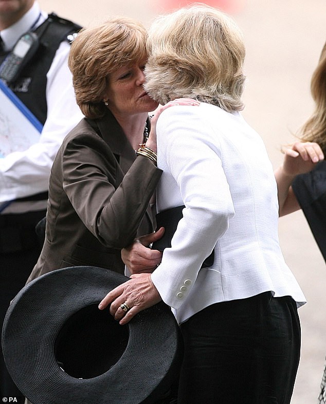 Sarah (left) and Jane embrace as they arrive for the Service of Thanksgiving for the life of Diana at the Guards' Chapel in London in August 2007