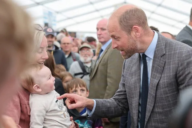 Chris Jackson/Getty Prince William meets baby George at the Royal Cornwall Show in June 6, 2025