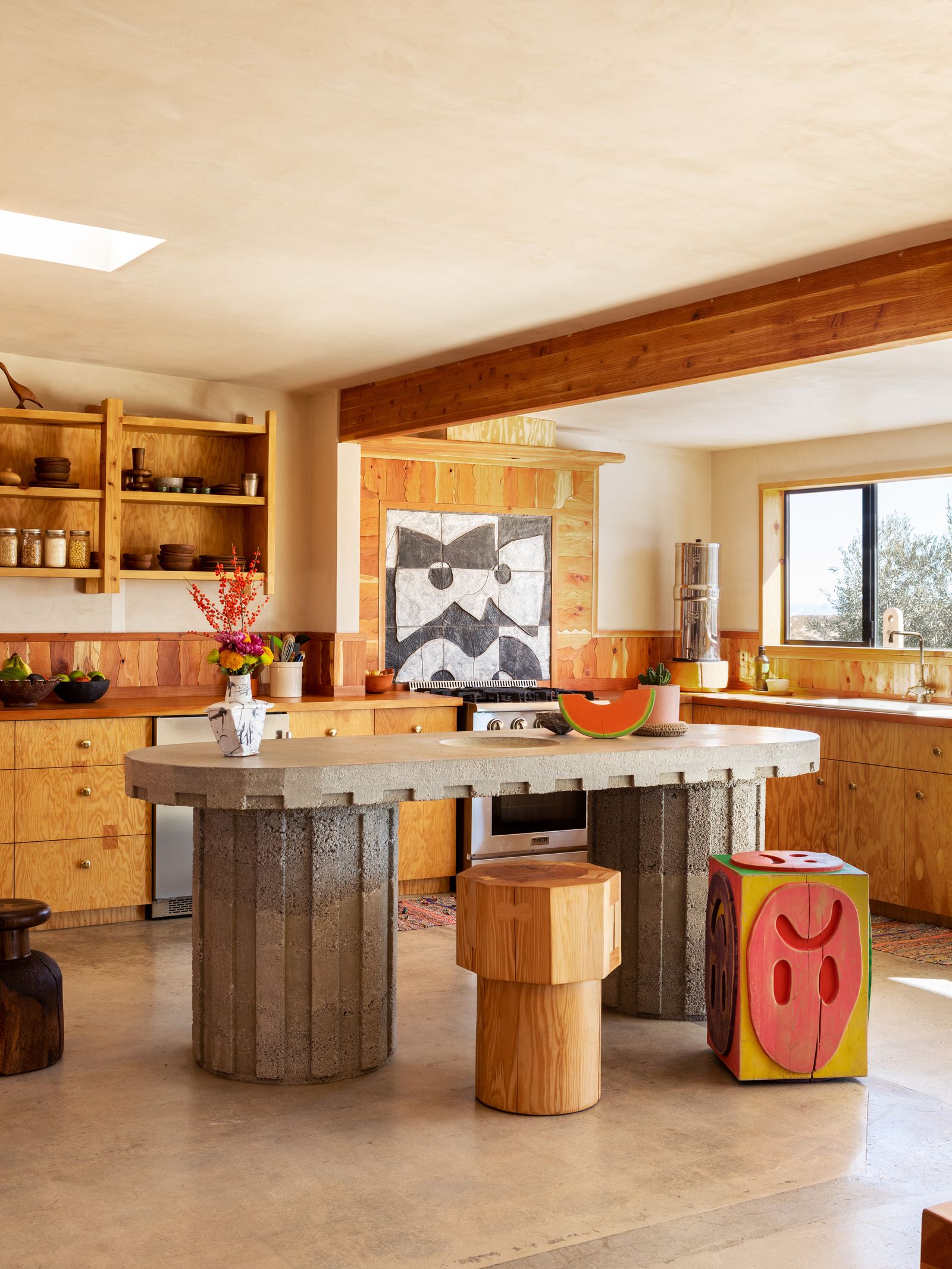 Image may contain Indoors Interior Design Kitchen Kitchen Island Cup Appliance Device and Electrical Device