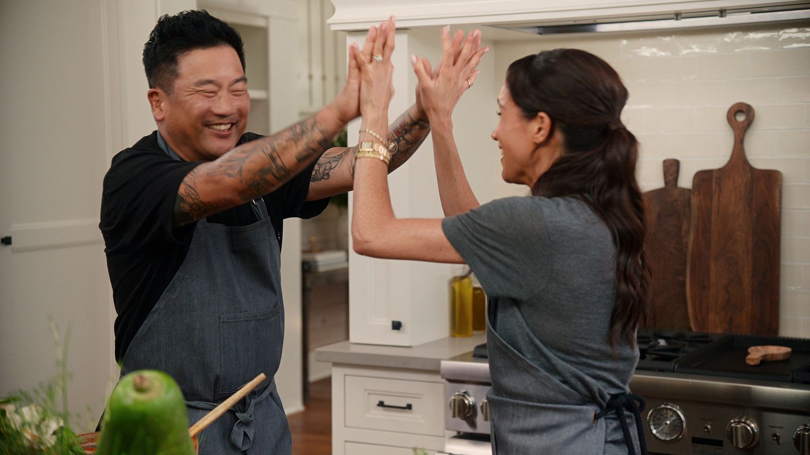 Image may contain Roy Choi Meghan Duchess of Sussex Adult Person Cooktop Indoors and Kitchen