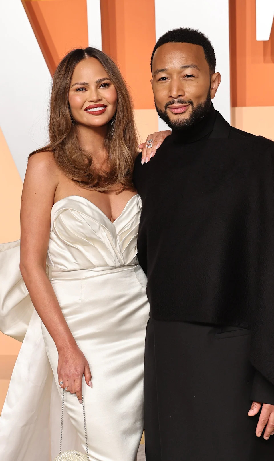 IChrissy Teigen and John Legend on a red carpet