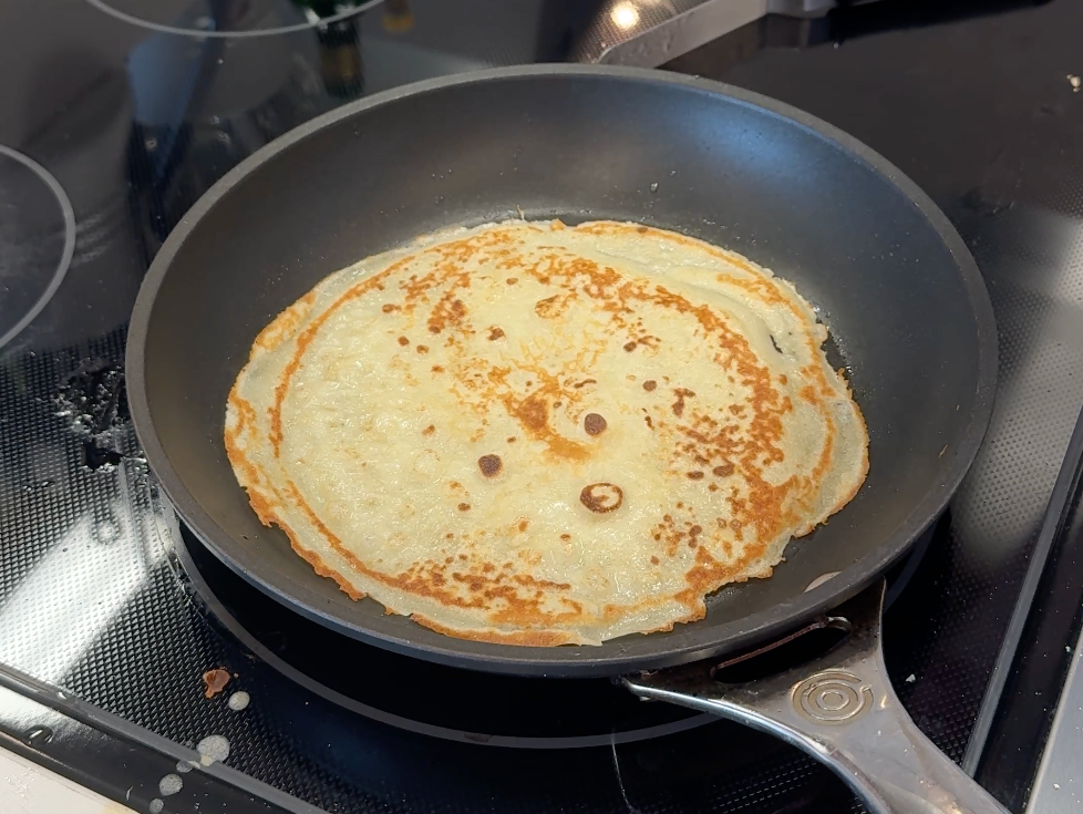 meghan markle as ever crepe mix being cooked in a pan on the stove