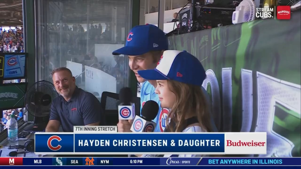 Hayden Christensen and his daughter get interrupted by a fighter jet during their count-off at Wrigley Field