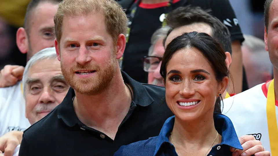 Peince Harry and Meghan Markle smiling