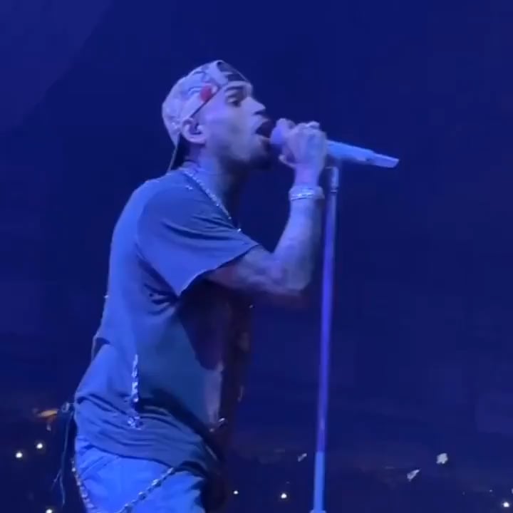Chris Brown narrowly dodges something thrown at him during his Detroit concert