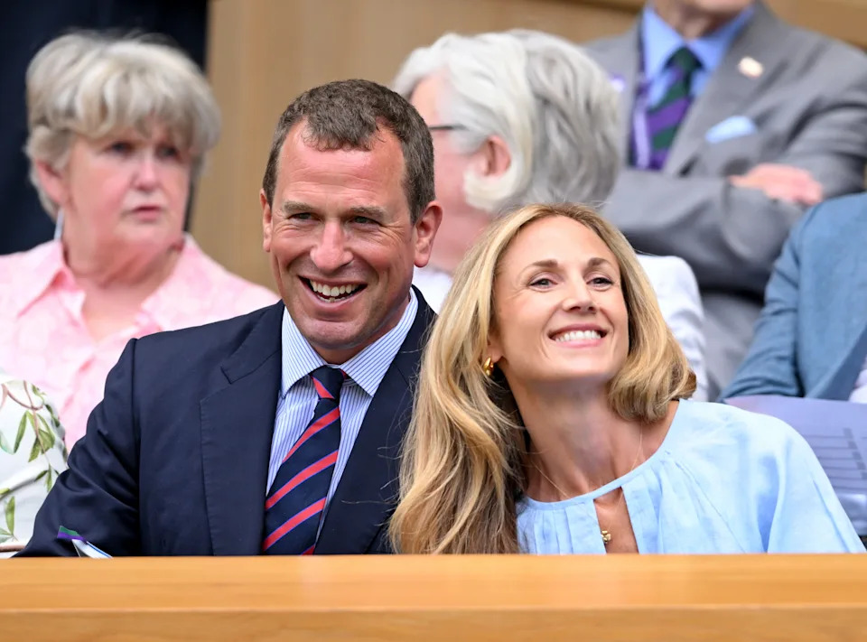 Peter Phillips and Harriet Sperling smiling at Wimbledon wearing shirts