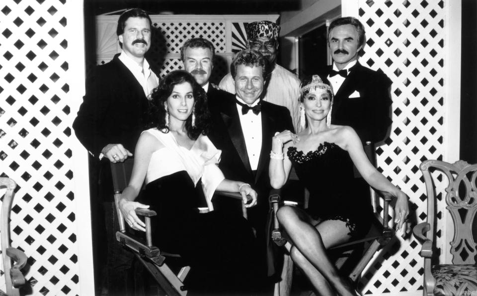 Black and white photo of Rita Moreno and other television cast members.
