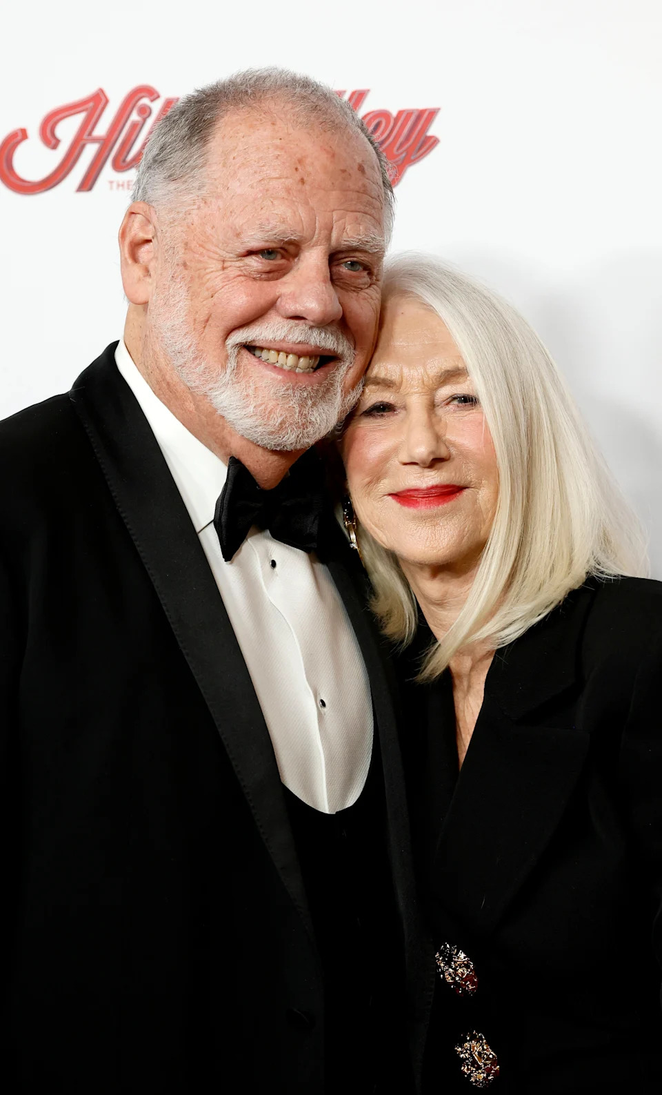 Taylor Hackford and Helen Mirren posing together on a red carpet