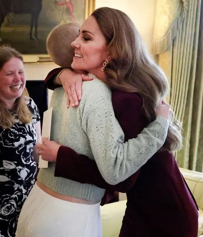Andrew Parsons / Kensington Palace Princess Kate hugs Liz Hatton at the family meeting at Windsor Castle, in October 2024