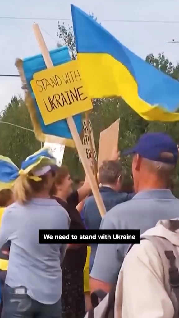 Protesters wave Ukrainian flags in Anchorage, Alaska, ahead of Trump-Putin summit