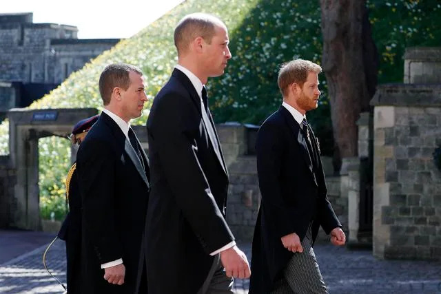 Alastair Grant/WPA Pool/Getty  Peter Phillips, Prince William and Prince Harry during the Ceremonial Procession during the funeral of Prince Philip at Windsor Castle on April 17, 2021