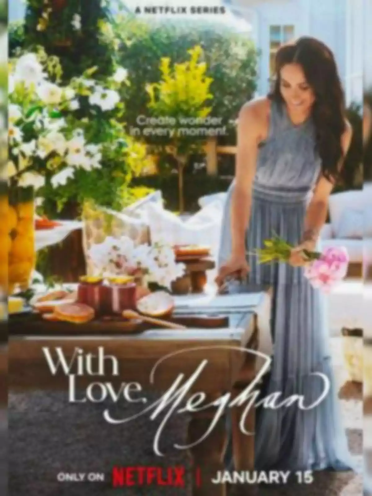 Meghan Markle in a light blue dress stands next to a table decorated with flowers and food in a garden, with the text Meghan Markle in a light blue dress stands next to a table decorated with flowers and food in a garden, with the text