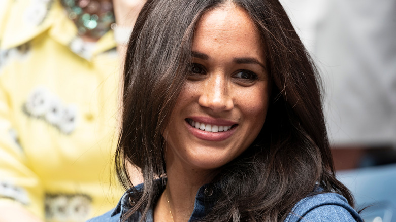 Headshot of smiling Meghan Markle, Duchess of Sussex