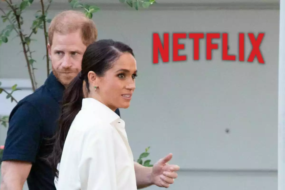 Prince Harry and Meghan Markle walking outdoors with the Netflix logo in the background.