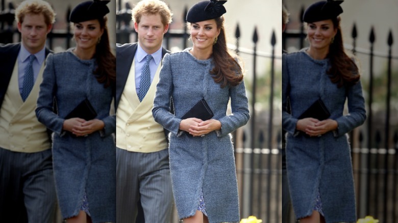 Kate Middleton smiles as she arrives at a wedding, with Prince Harry behind