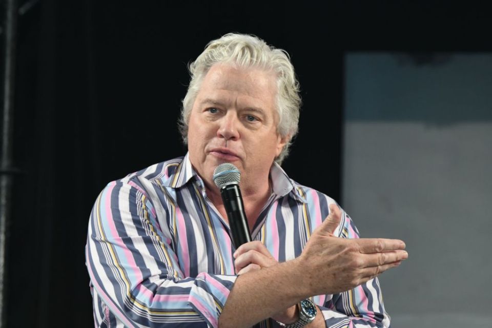 Thomas F. Wilson speaking at a microphone.
