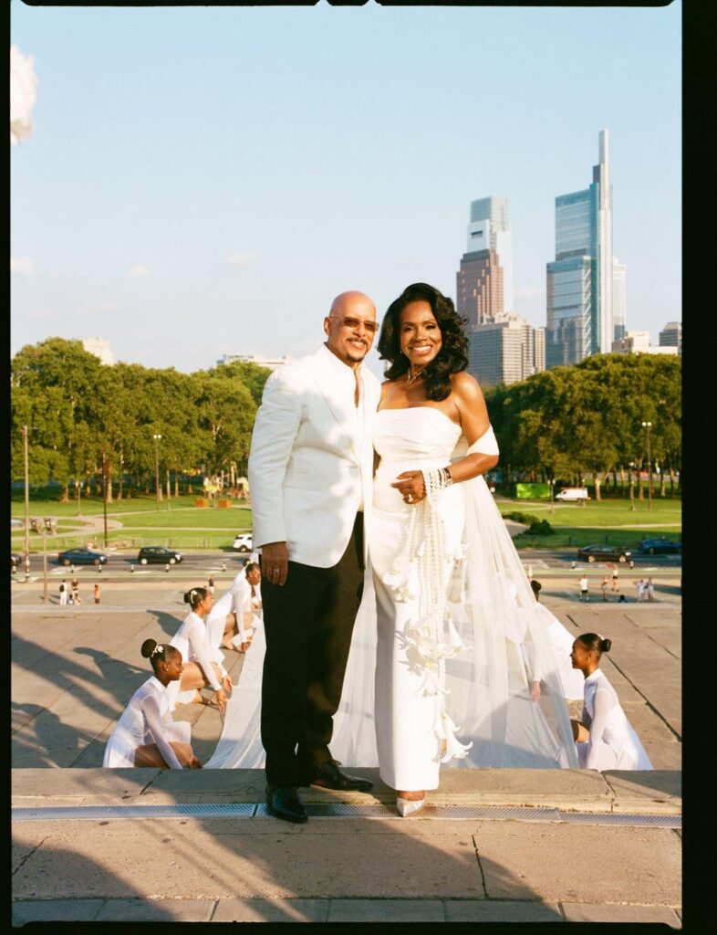 Sheryl Lee Ralph wore a custom Monsoori Haute Couture dress & an 80ft shawl for her vow renewals to Sen. Vincent Hughes, on the Rocky Steps at the Philadelphia Museum of Art. | “How could I walk up all of those steps without leaving a trail of something for everybody to look at?” she tells Vogue.