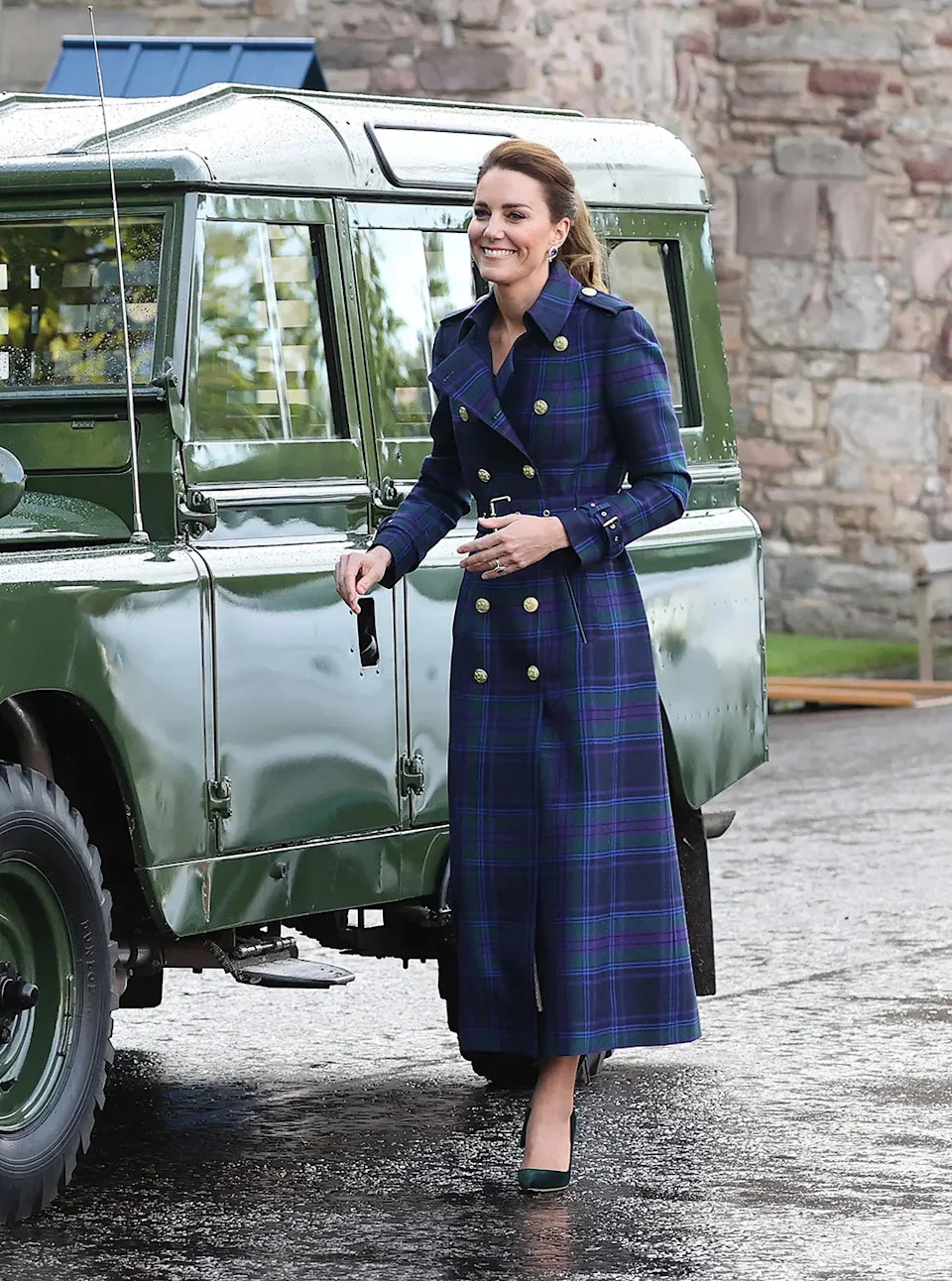 Kate Middleton smiling next to Prince Philip's van in the U.K.