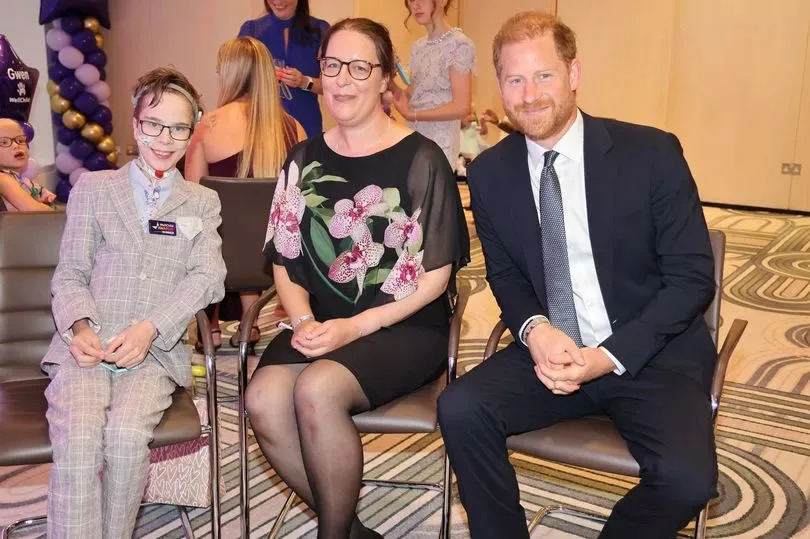 Ansel Hayward, 13, from Birmingham, with Prince Harry at the Royal Lancaster Hotel in London