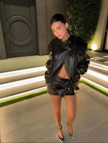 Instagram/Kylie Jenner Kylie Jenner with a skirt made out of belts