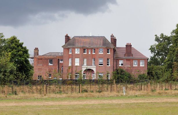 Forest Lodge Windsor exterior with grass and the Lodge itself to the forefront of the pic
