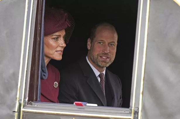 Kate Middleton with Prince William inside a royal carriage